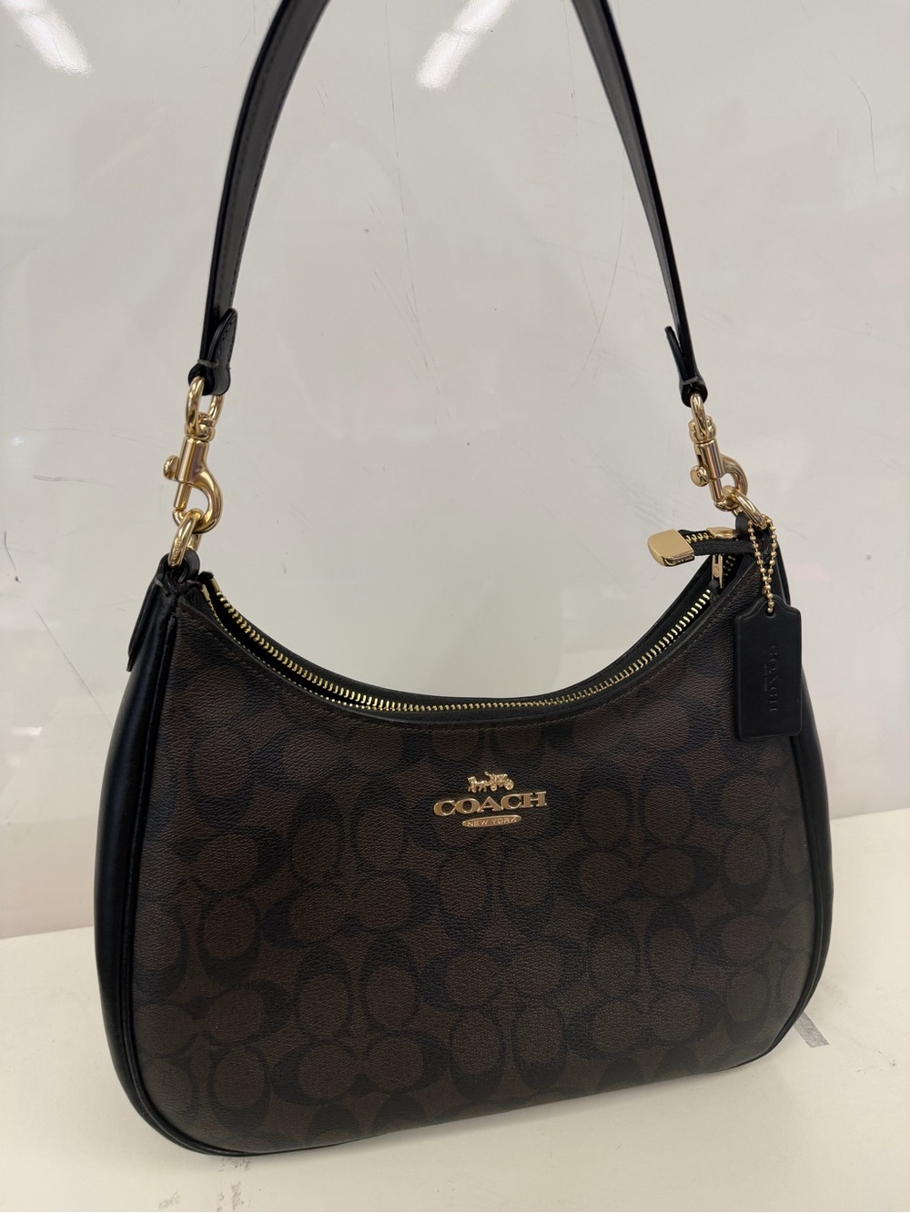 Coach Dark Brown Signature Canvas Shoulder Bag with Black Trim and Gold Hardware